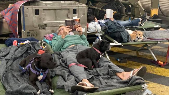 Relaxing with a dog and a book. Pictures: Kristine Daniels/Facebook