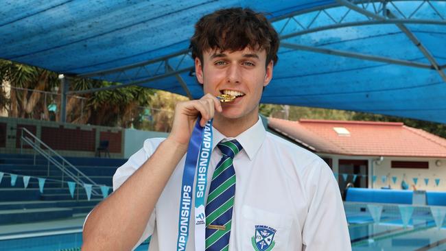 Sean Reid of Ambrose Treacy College enjoying his medal.