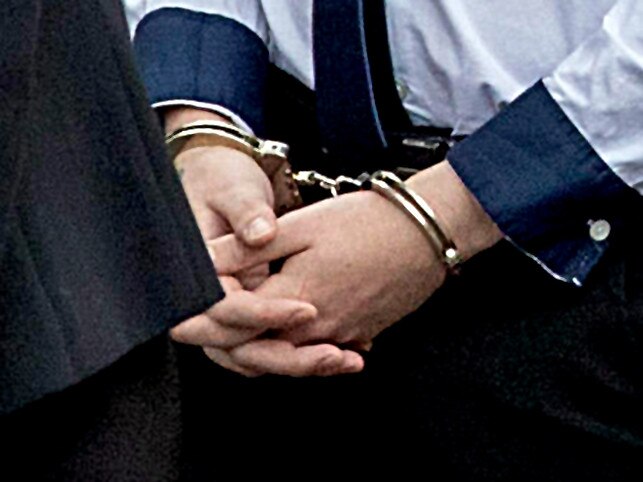 *FILE PIX* NCA NewsWire Photos: Editorial generic stock photo of person in handcuffs. Picture: NCA NewsWire