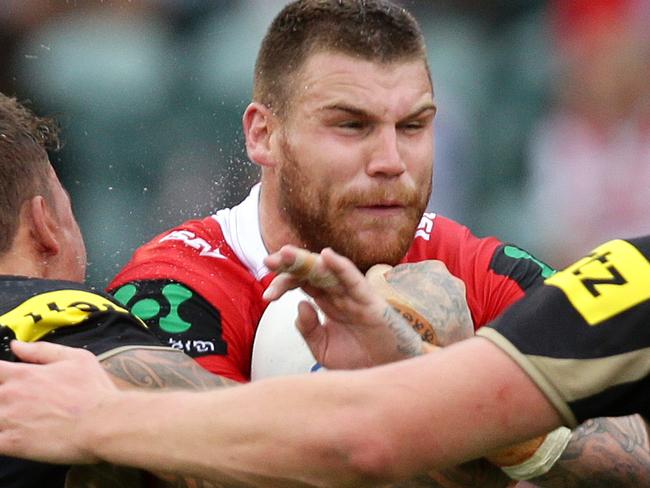Dragon's Josh Dugan wrapped up by the defense during the Round 4 NRL game between the St George Illawarra Dragons and the Penrith Panthers at WIN Stadium , Wollongong .Picture Gregg Porteous