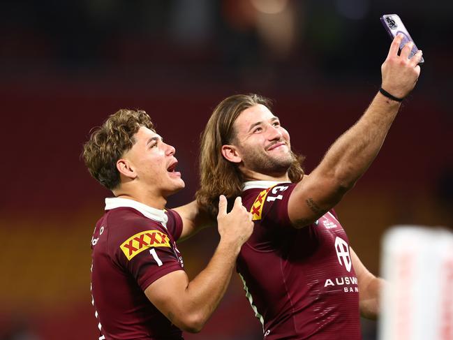 (L-R) Reece Walsh and Patrick Carrigan of the Maroons take a selfie after winning game two. Picture: Getty Images