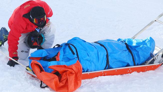 Rina Yoshika receives medical attention after crashing during the Snowboard Slopestyle training session in Zhangjiakou, China. Picture: Getty Images