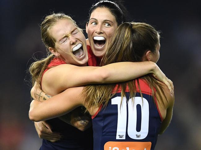 MELBOURNE, AUSTRALIA - MARCH 09: The Demons celebrate winning the round six AFLW match between the Western Bulldogs and the Melbourne Demons at Marvel Stadium on March 09, 2019 in Melbourne, Australia. (Photo by Quinn Rooney/Getty Images)