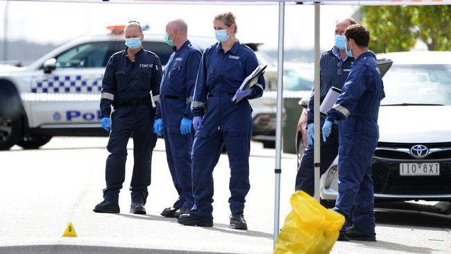 Police investigate the area around Observatory St at Clyde North after the father and son were fatally stabbed. Picture: Andrew Henshaw