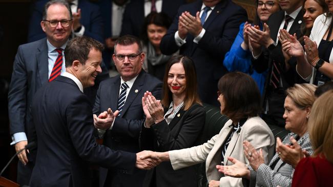 The opposition benches congratulate Mr Speakman after his budget response. Picture: Dan Himbrechts