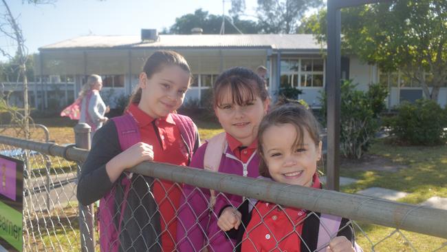 Gympie West State School students Amali Turner and Layla Sims were excited to join Prep student Ella Turner at school yesterday. Picture: Frances Klein