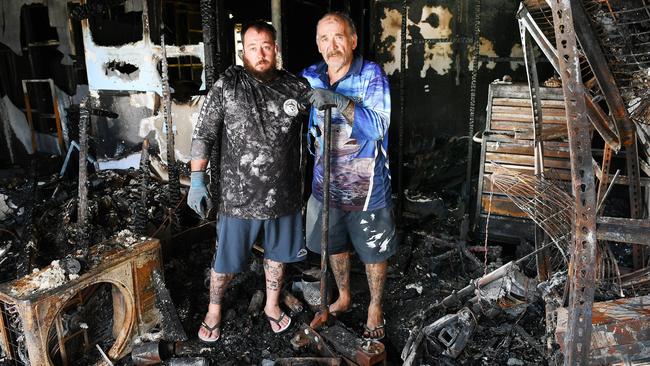 Disability pensioner Darryl Hurst, pictured with his son Tye Hurst, is facing unimaginable heartbreak after his family home in South Townsville was reduced to ash and rubble in a devastating fire sparked by an e-scooter explosion on Monday. Picture: Shae Beplate.