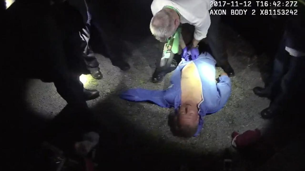 Andrew Cobby laying on the ground after being found by police on the night of the murder.