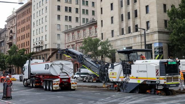 Construction on the new tram lines on the corner of North Tce and King William St. Picture: AAP/Russell Millard