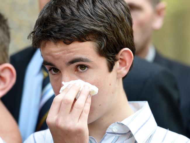 The son of NSW police officer Bryson Anderson, Cain, wipes his eyes as he leaves NSW Court of Criminal Appeal. Picture: AAP/Paul Miller