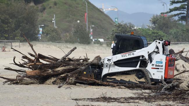 Council machinery begin cleaning up debris on Coolangatta Beach after severe weather earlier in this week on the Gold Coast. Picture: NCA NewsWire / Steve Holland