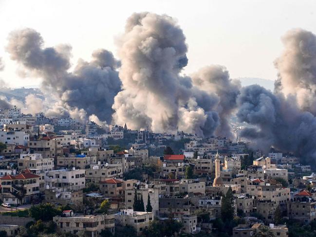 Smoke billows from the site of several explosions during an Israeli raid in the occupied West Bank city of Jenin on February 2, 2025. The Israeli military launched a major offensive in the West Bank last month dubbed "Iron Wall" aimed at rooting out Palestinian armed groups from the Jenin area, which has long been a hotbed of militancy. (Photo by MOHAMMAD MANSOUR / AFP)