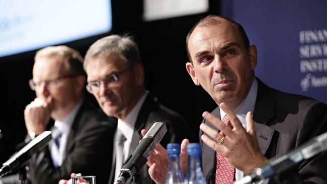 Left to right, RBA governor Philip Lowe, ASIC chair Greg Medcraft and APRA chairman Wayne Byres on a panel. Picture: Adam Yip.