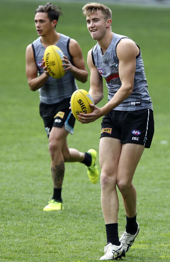 Port Adelaide's Aidyn Johnson and Dougal Howard at the captains run at Adelaide Oval.