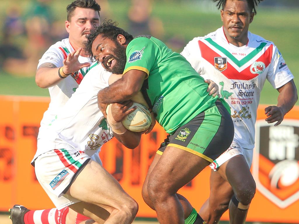 Palmerston’s Sean Huirahne takes on a big tackle in the NRL NT A-Grade match between Nightcliff Dragons and Palmerston Raiders. Picture: Glenn Campbell