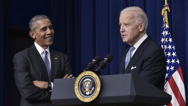 Then US Vice President Joe Biden speaks watched by US President Barack Obama in 2016.
