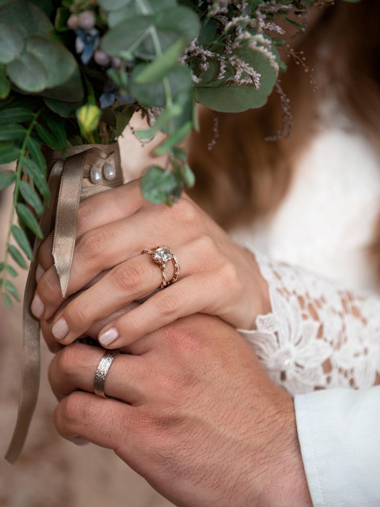 Chandler Powell and Bindi Irwin hands with the wedding rings. Picture: Kate Berry