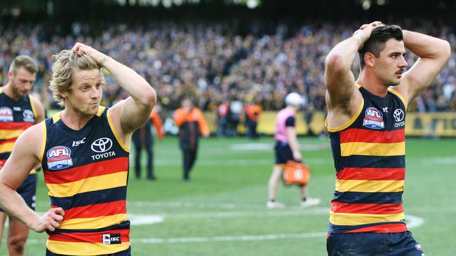 Rory Sloane and Taylor Walker show the disappointment of the grand final loss.