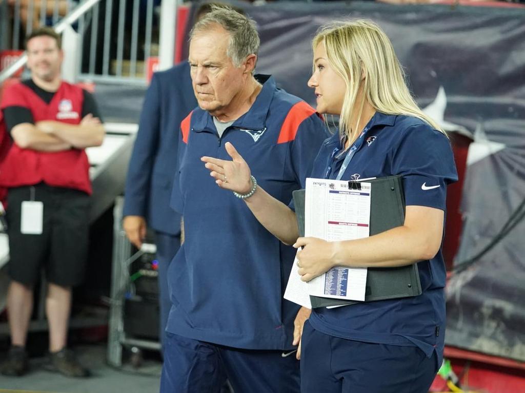 Aussie New England Patriots staffer Stephanie Burnham speaks to coaching legend Bill Belichick.