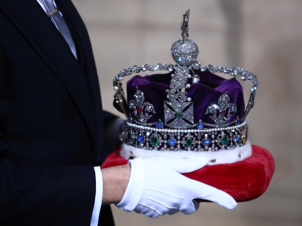 The Crown sat on its own cushion and travelled by coach. Picture: Hannah McKay - WPA Pool/Getty Images.