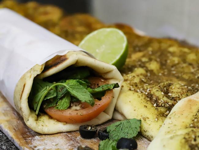 The oregano manoosh (Lebanese pizza) and vegetable wrap. Picture: Jenifer Jagielski