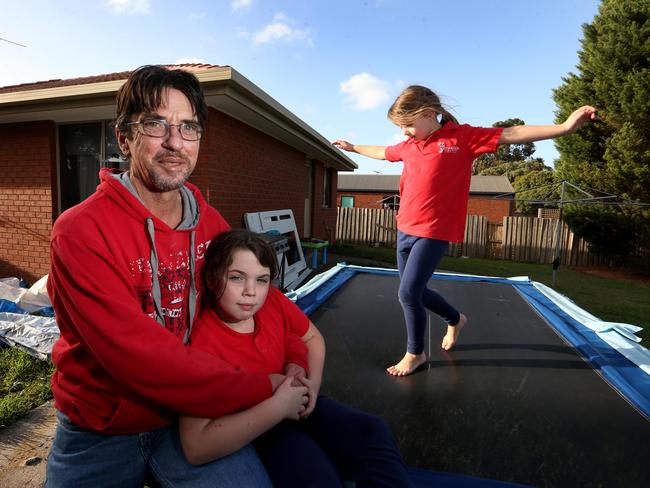Duncan Storrar with his daughters Indica, 8 and Jakaylah-rose 6 at their home in Geelong, Victoria. Picture: David Geraghty/The Australian
