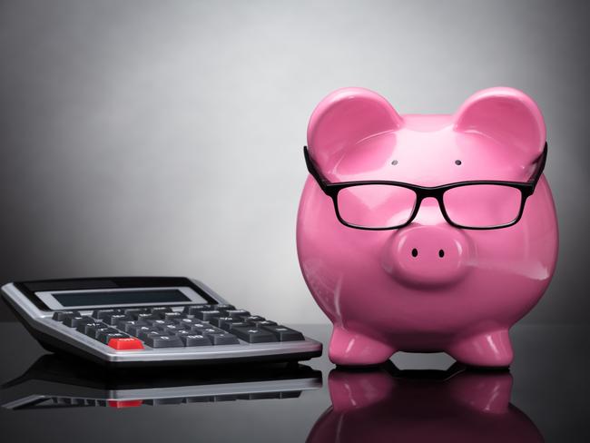 Close-up Of Pink Piggy Bank And Calculator On Grey Background; superannuation saving generic