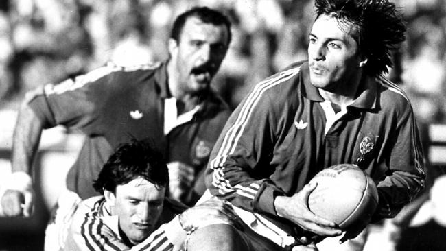 Andrew Slack tackles Philippe Sella, the prince of centres, at the SCG in 1986