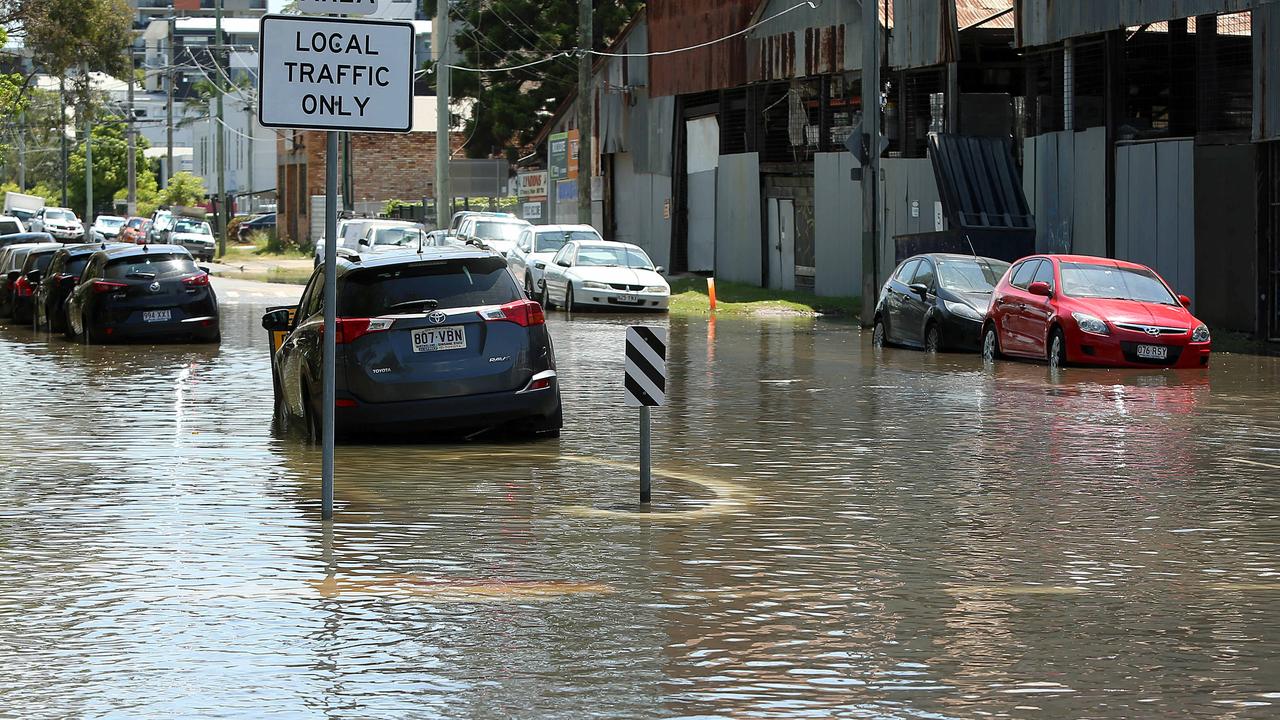 Northey Street in Windsor during local flooding from Enoggera Creek, sparked by a king tide, the supermoon and the effects of Cyclone Oma. Picture: AAP