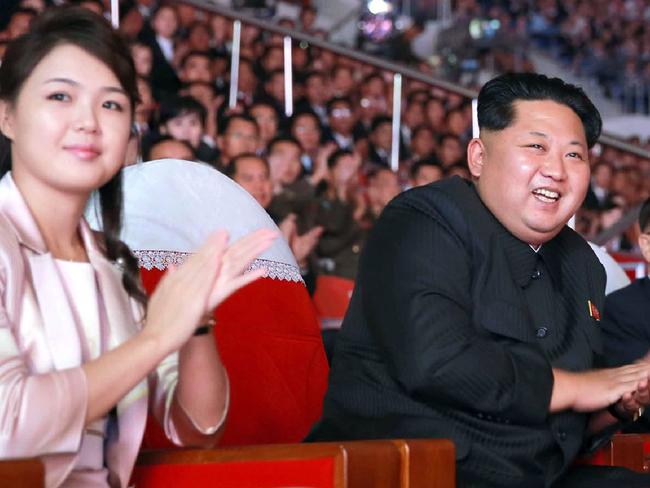 (FILES) This undated file picture released by North Korea's official Korean Central News Agency (KCNA) on October 19, 2015 shows North Korean leader Kim Jong-Un (C), accompanied by his wife Ri Sol-Ju (L), enjoying a joint performance by the state merited chorus and the Moranbong band for celebrating the 70th founding anniversary of the Workers' Party of Korea (WPK) at the Ryugyong Chung Ju-yung gymnasium in Pyongyang. North Korean leader Kim Jong-Un has fathered another child, reports said on August 29, 2017, after his wife dropped out of the public eye for several months. First lady Ri Sol-Ju delivered the couple's third child in February, the Yonhap news agency reported Tuesday, citing South Korean lawmakers who were briefed by the National Intelligence Service. / AFP PHOTO / KCNA VIA KNS / STR / South Korea OUT / REPUBLIC OF KOREA OUT   ---EDITORS NOTE--- RESTRICTED TO EDITORIAL USE - MANDATORY CREDIT "AFP PHOTO/KCNA VIA KNS" - NO MARKETING NO ADVERTISING CAMPAIGNS - DISTRIBUTED AS A SERVICE TO CLIENTS THIS PICTURE WAS MADE AVAILABLE BY A THIRD PARTY. AFP CAN NOT INDEPENDENTLY VERIFY THE AUTHENTICITY, LOCATION, DATE AND CONTENT OF THIS IMAGE. THIS PHOTO IS DISTRIBUTED EXACTLY AS RECEIVED BY AFP.  /