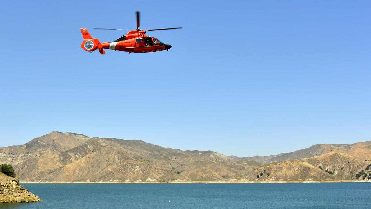 A US Coast Guard helicopter flies over Lake Piru where actress Naya Rivera was reported missing. Picture: Amy Sussman/Getty Images