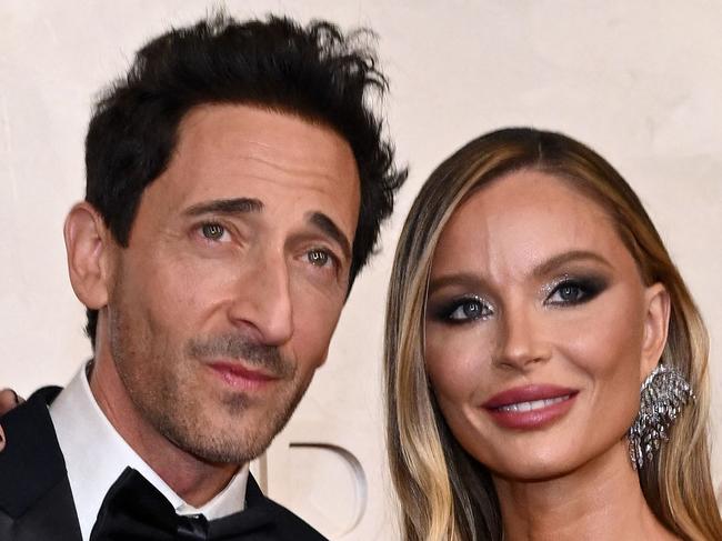 (From L) US actor Adrien Brody and British fashion designer Georgina Chapman attends the 97th Annual Academy Awards at the Dolby Theatre in Hollywood, California on March 2, 2025. (Photo by ANGELA WEISS / AFP)