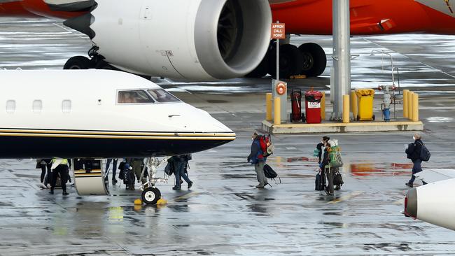 Passengers from New Zealand who arrived in Melbourne board a smaller jet for the trip across the Tasman. Picture: Getty