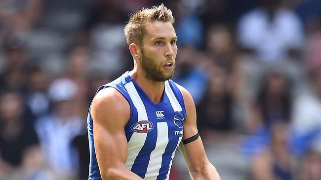 Jamie MacMillan of the Kangaroos is seen in action during the Round 1 AFL match between the North Melbourne Kangaroos and West Coast Eagles at Etihad Stadium in Melbourne, Sunday, March 26, 2017. (AAP Image/Julian Smith) NO ARCHIVING, EDITORIAL USE ONLY