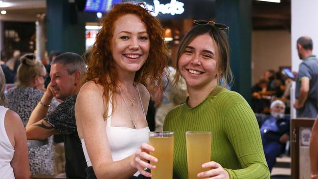 Cairns women Bonn Marie and Maddi Levers enjoy a drink before heading to Byron Bay. Picture: Brendan Radke