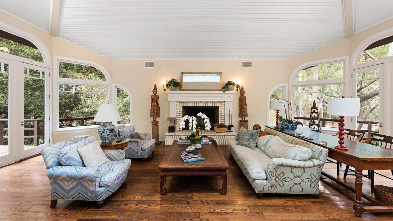 The formal living room is flanked by ornate windows on either side. Picture: Marc Angeles/TopTenRealEstateDeals