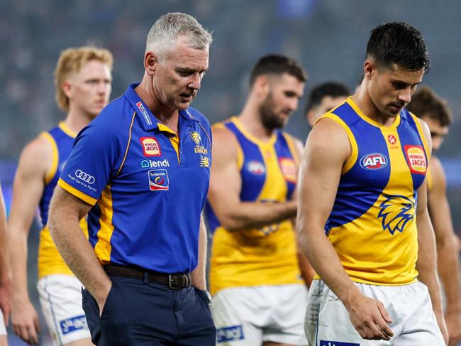 MELBOURNE, AUSTRALIA - MARCH 31: Adam Simpson, Senior Coach of the Eagles and Liam Duggan of the Eagles leave the field after a loss during the 2024 AFL Round 03 match between the Western Bulldogs and the West Coast Eagles at Marvel Stadium on March 31, 2024 in Melbourne, Australia. (Photo by Dylan Burns/AFL Photos via Getty Images)