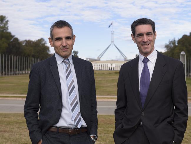 United Nations Social Affairs Officer Marco Roncarati (right) and Senior Economist of the OECD Stephane Carcillo pose for photographs during the First Global CoAct Conference 'The Power of Many' in Canberra, Tuesday, June 23, 2015. (AAP Image/Lukas Coch) NO ARCHIVING