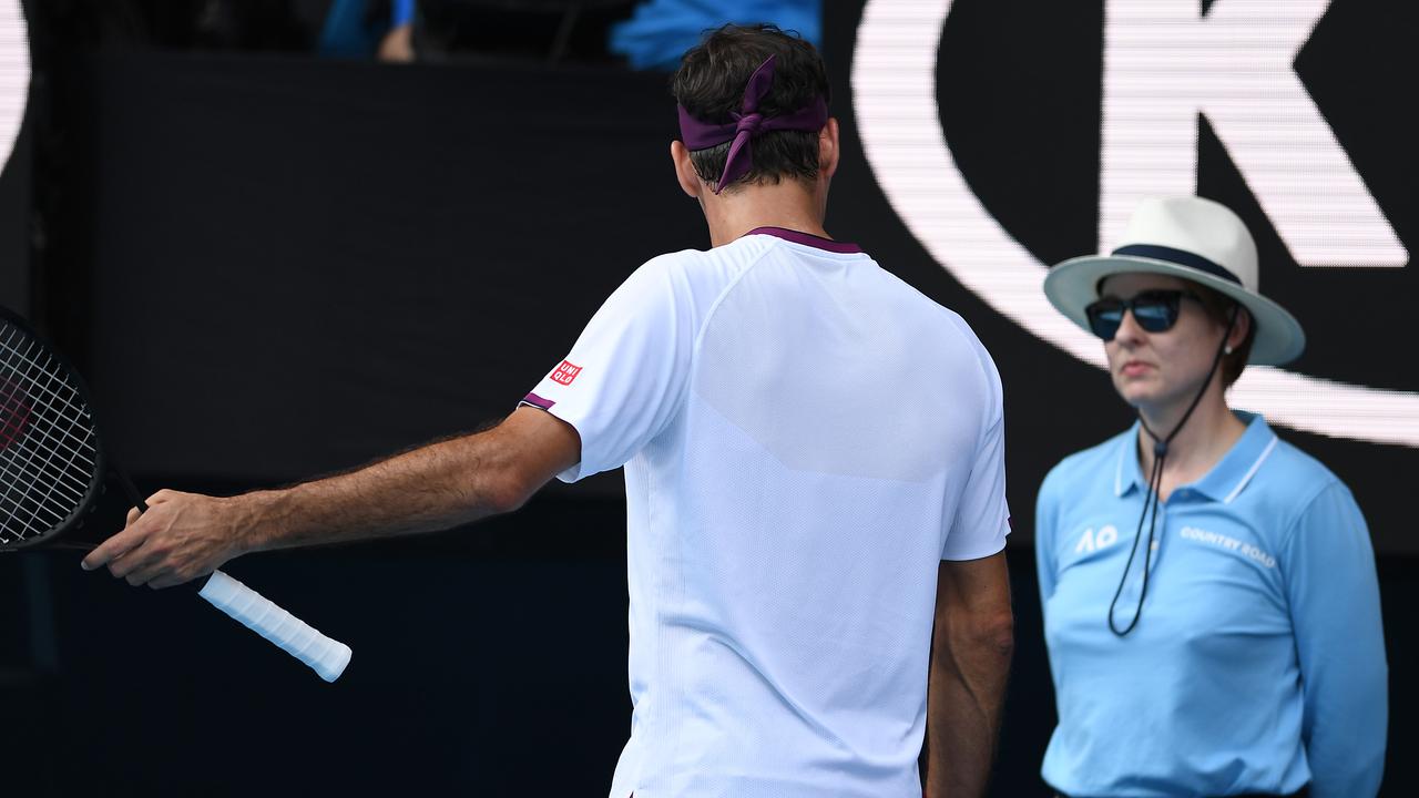 Roger Federer questions a lines person during his Mens Singles Quarterfinal match against Tennys Sandgren. Photo: Morgan Hancock/Getty Images
