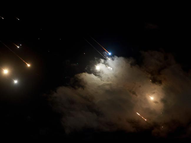 TOPSHOT - This picture shows projectiles above Jerusalem, on October 1, 2024. Iran has launched a missile attack on Israel's commercial hub Tel Aviv, state media reported on October. (Photo by Menahem Kahana / AFP)