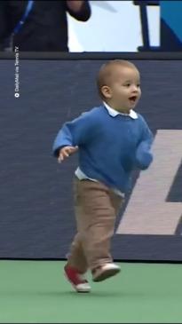 Toddler runs onto major tennis court to find dad