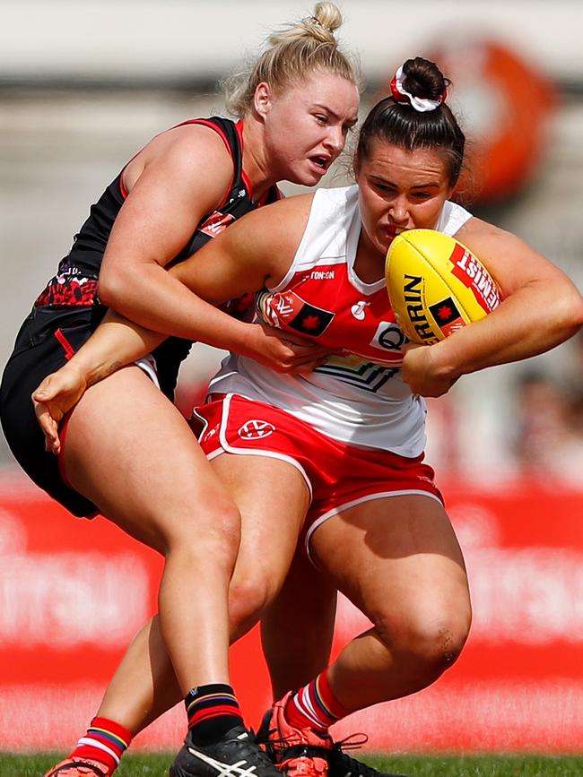 Daria Bannister applies one of her trademark tackles on Lauren Szigeti.