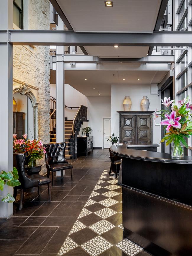 Old stone and modern glass combine in the lobby.