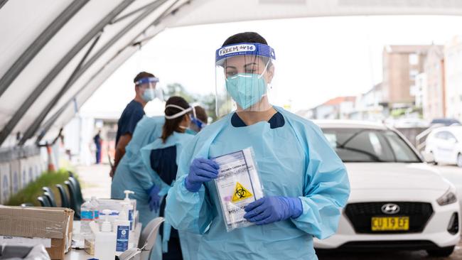 Healthcare workers prepare to test a patient at a drive-through testing station in Bondi Beach, Sydney. Picture: NCA NewsWire / James Gourley