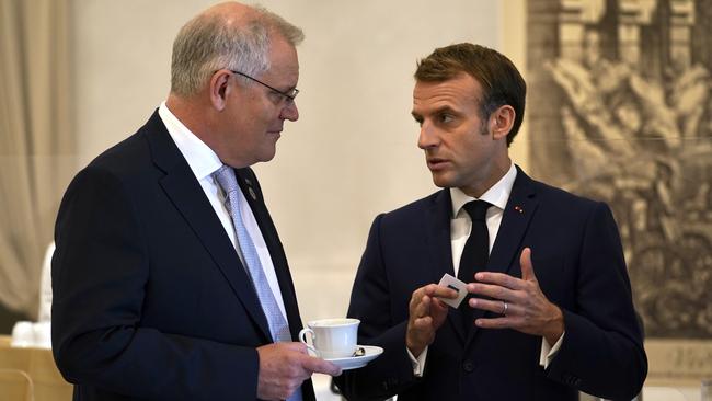 Australian Prime Minister Scott Morrison and French President Emmanuel Macron talk at the G20 gathering in Rome. Picture: Adam Taylor