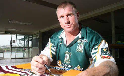 Former State of Origin player Chris Beattie signs jerseys in preparation for tonight’s Legends of League game at North Ipswich Reserve. . Picture: Rob Williams