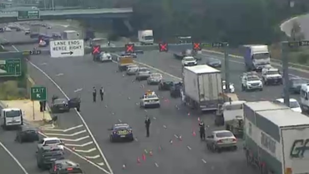 Police divert traffic on the Metropolitan Ring Road after a police pursuit. Picture: VicTraffic