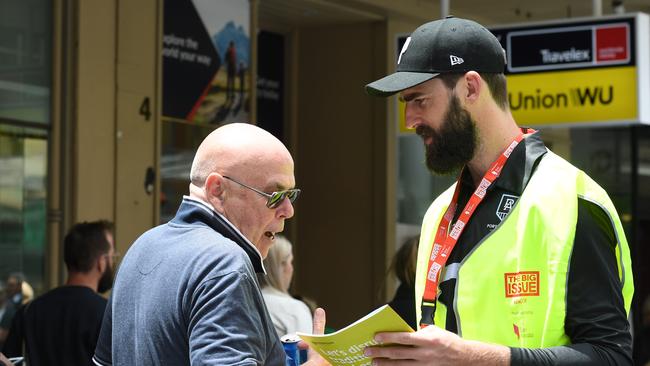 Port Adelaide's Justin Westhoff selling Big Issue in Rundle Mall with Daniel. Picture: Tricia Watkinson