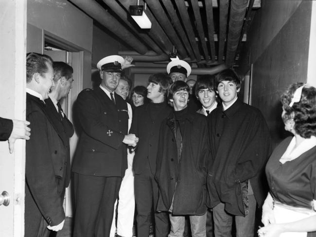 The Beatles with security and hotel staff at the Southern Cross Hotel. Picture: Laurie Richards/ Supplied