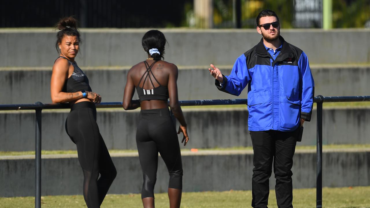 Security speaks to Australian sprinter Morgan Mitchell (left). Photo: Quinn Rooney/Getty Images.